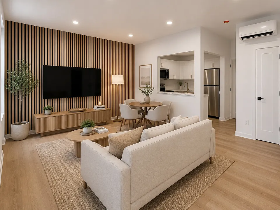 Virtually staged living and dining area showing one possible layout based on the floor plan dimensions. Apartment is delivered unfurnished.