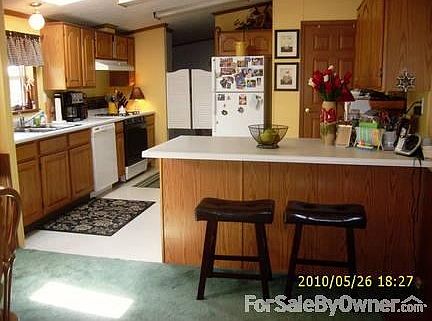 Living/Great Room/Eating Area
						:
						Wood Burning Fireplace, Sliders to Deck