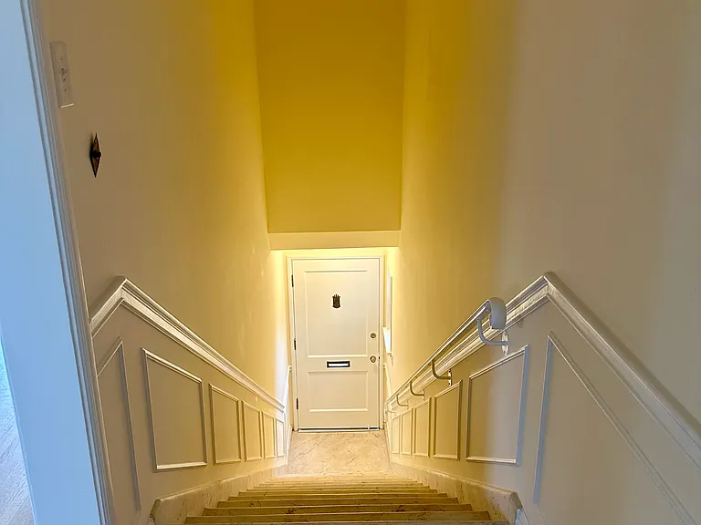Looking down at the lovely private staircase entryway