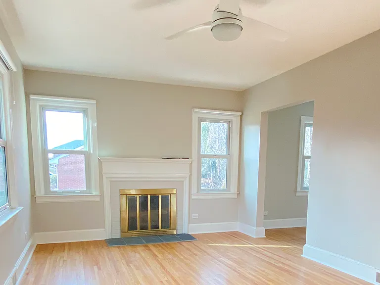 Living room with walkway into dining area or office