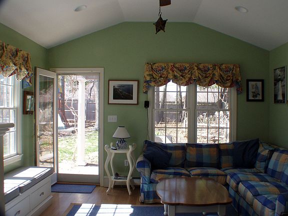 sunny den with window seat and built-ins