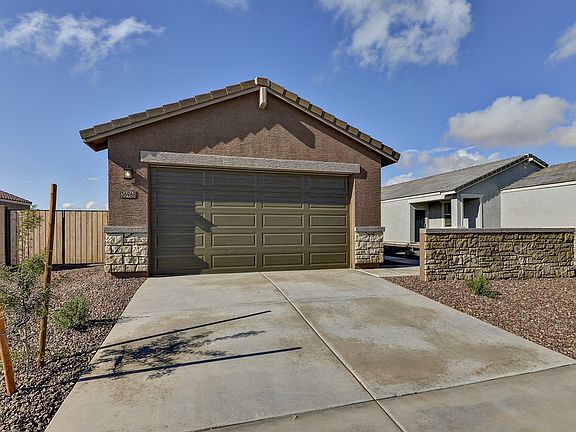 Move in now to the Juniper floorplan at 36968 N Sidewinder Dr at Archer Meadows.