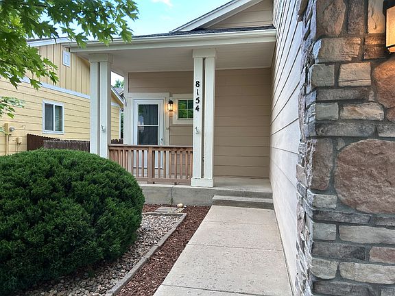Screened storm door allows light in and cross-ventilation.