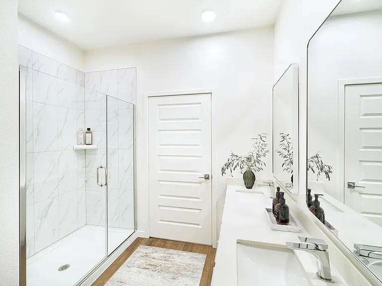 A bright, polished primary bath offering refined finishes and everyday comfort at Modera Encore in Tampa.