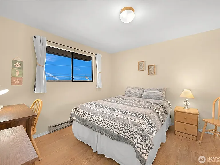Queen size bed, work table and bookcase.
