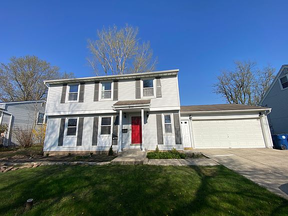 Front exterior with attached 2 car garage