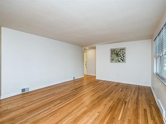 Living Room with Stunning Hardwood Floors!