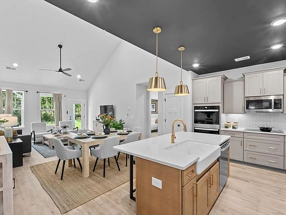 Accomplished design in a kitchen that blends function and form with a right-sized island in Fountain