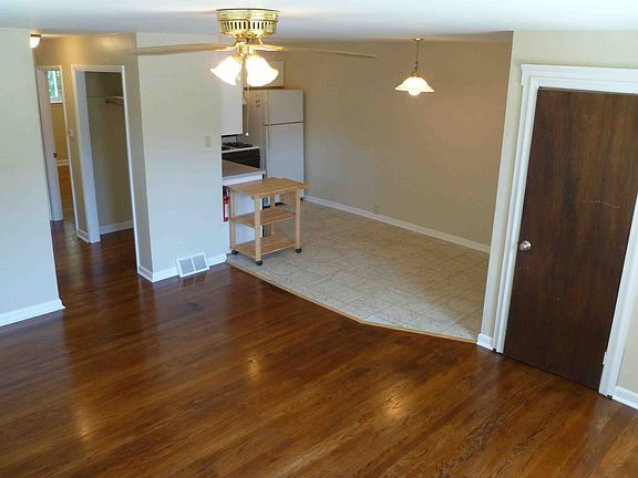 In the living room facing the kitchen
