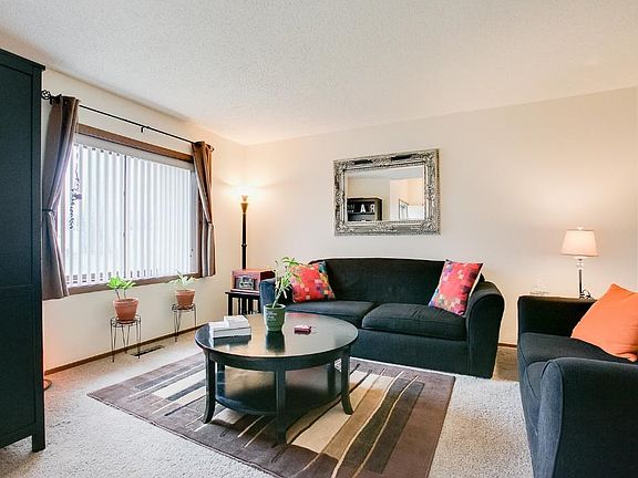 Spacious living room with lots of sunshine!