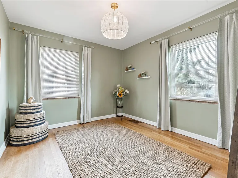 2nd main flr bed. Queen bed in bsmt used to be here. Also, don't miss the large closet behind bedroom door.