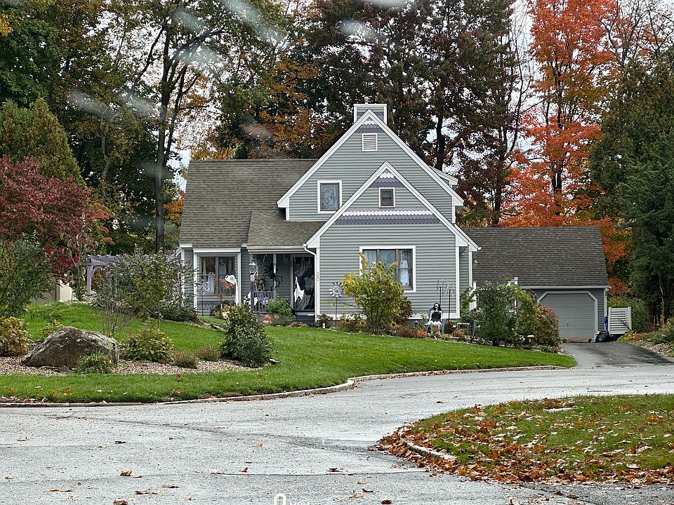 Front of house. Sits on private cul-de-sac. 16 Victorian Gingerbread Homes with second cul-de-sac. Driveway parking for 4-5 cars. Does not include garage.