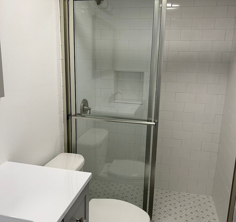 NEW bathroom with marble tile and counters