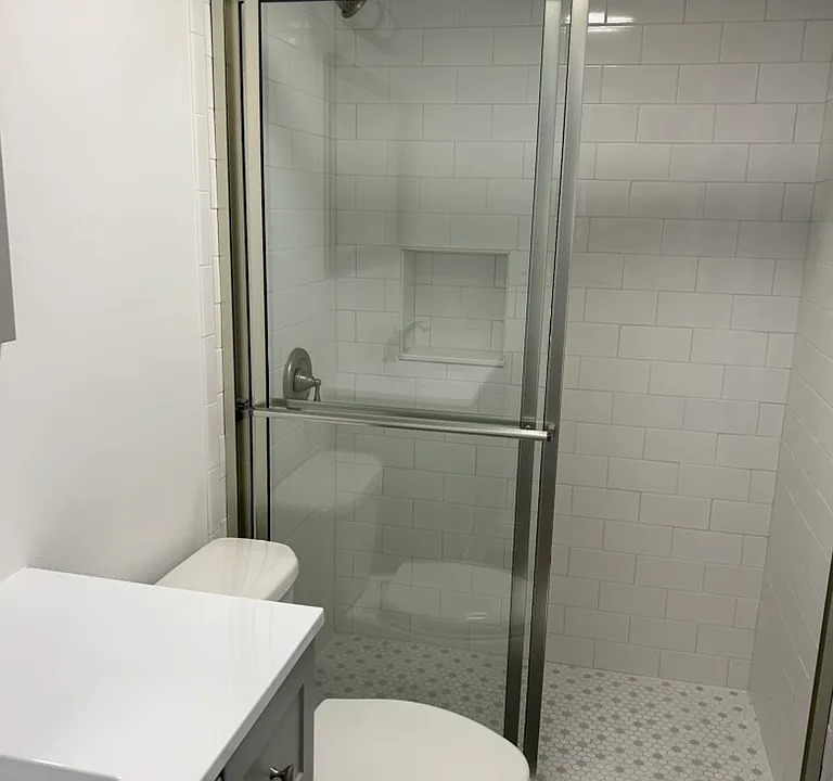 NEW bathroom with marble tile and counters