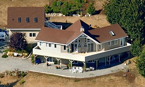 Aerial view of house with detached garage/guest room