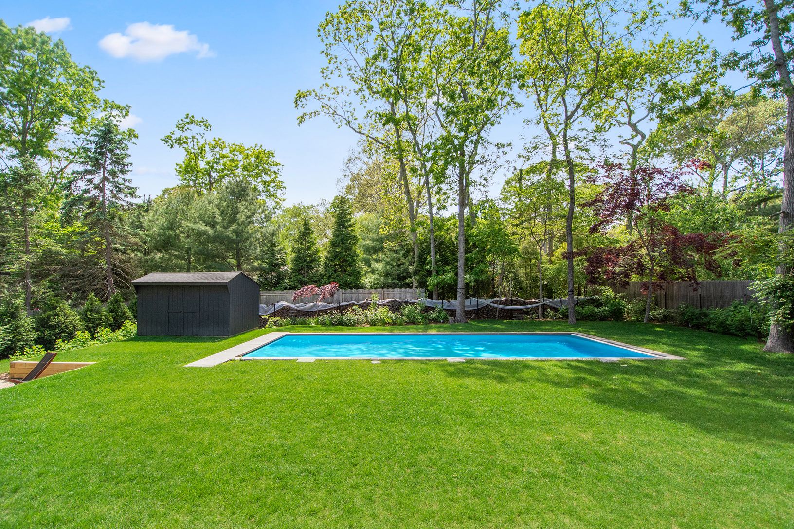  Heated Pool Surrounded by Green Lawn