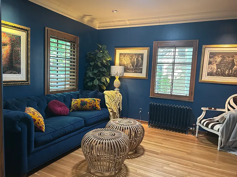 Den and reading room with large screen tv and French doors that close.