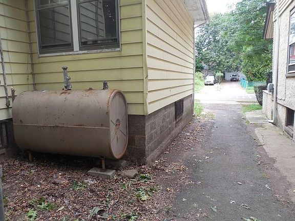 Side of house / Driveway / Above ground oil tank