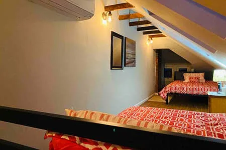 2 Full Beds, skylights & quaint sitting area. Upper level has it's own mini-split unit to control AC/heat