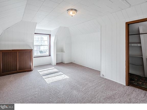 Living room. Closet has pocket door.