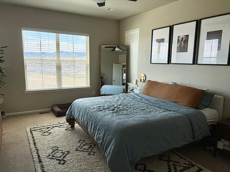 Primary bedroom off of kitchen and dining area