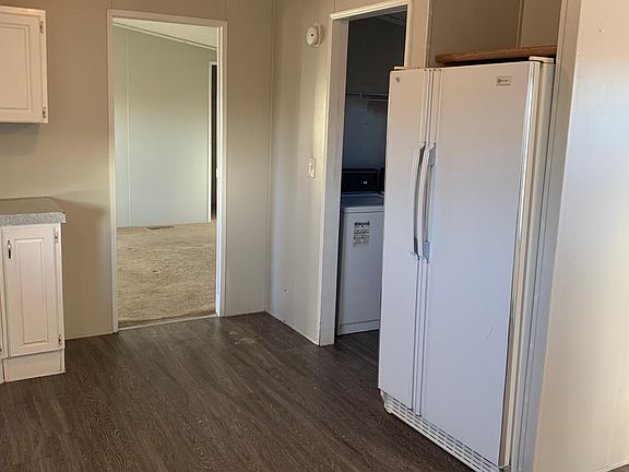 master adjacent to the kitchen & laundry room