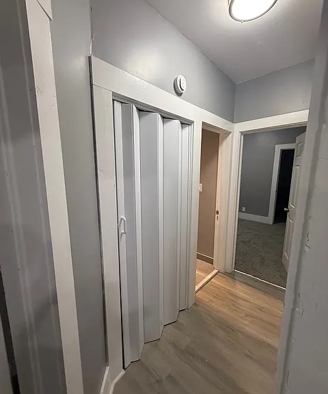 HALLWAY LEADING TO BATHROOM AND SECOND BEDROOM.