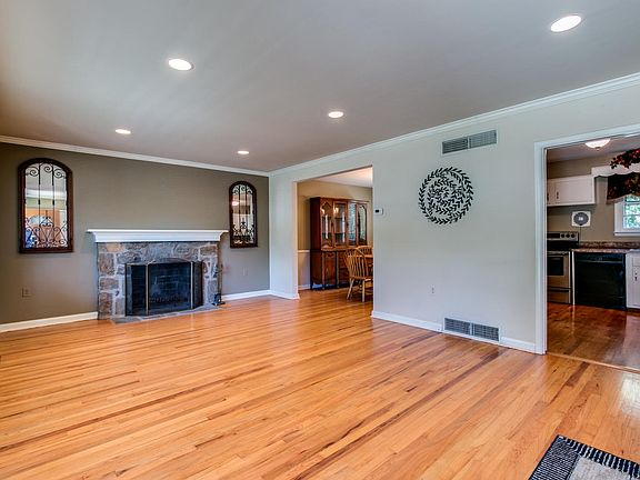 Bright living room with stone fireplace