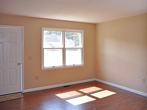 Living room with new entry door and picture window