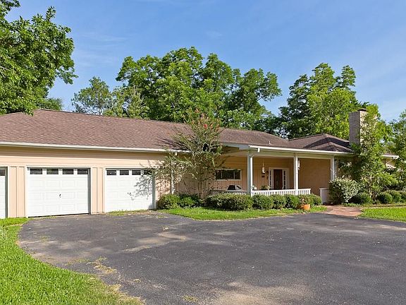 Front elevation showing the 3 car garage, extra wide driveway and covered porch.