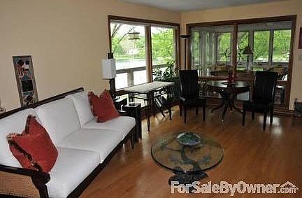 Living Room
						:
						Hardwood floors and incredible lake views from a wall of windows, fireplace.
