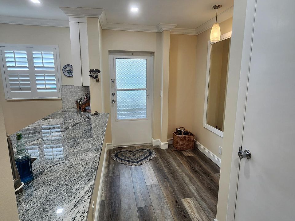 Looking to entry way from living space.
