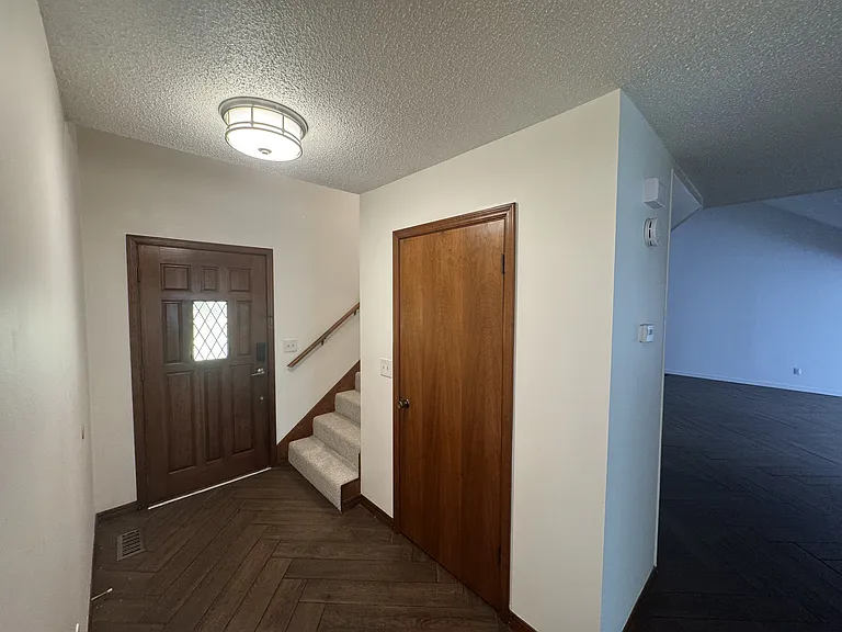 Entry w/coat closet. Living room on right