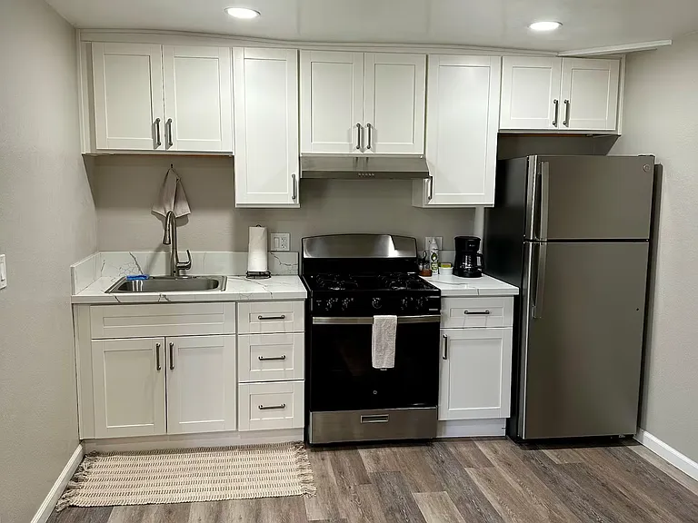 Upgraded Kitchen with stainless Fridge, Oven/Stove, Sink and plenty of cabinets!