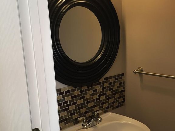 Beautiful tiled accent wall in powder room