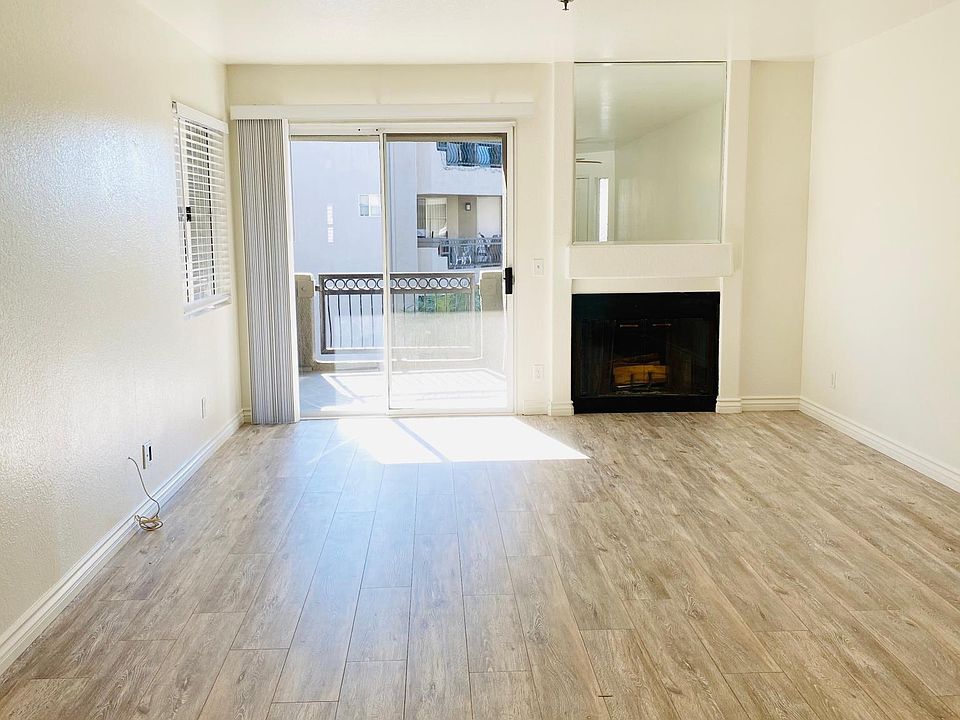 Living room adjacent to balcony with lots of natural light.