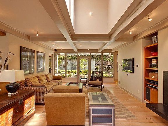 Spacious and light filled family room. Large picture windows take advantage of the abundant light an