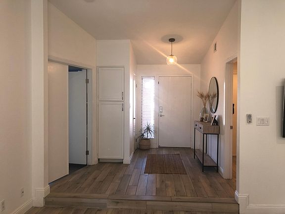 Front entry, laundry room on right master bed on left