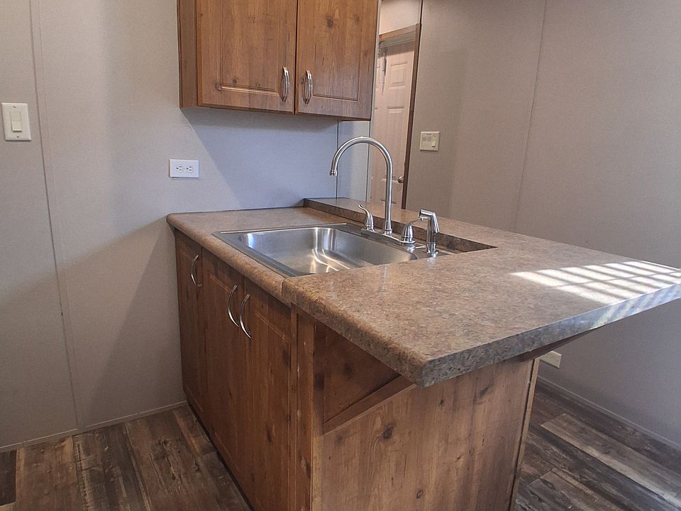 "Kitchen includes a separate sink area for added ease of movement while cooking, along with plenty of storage to keep everything organized."