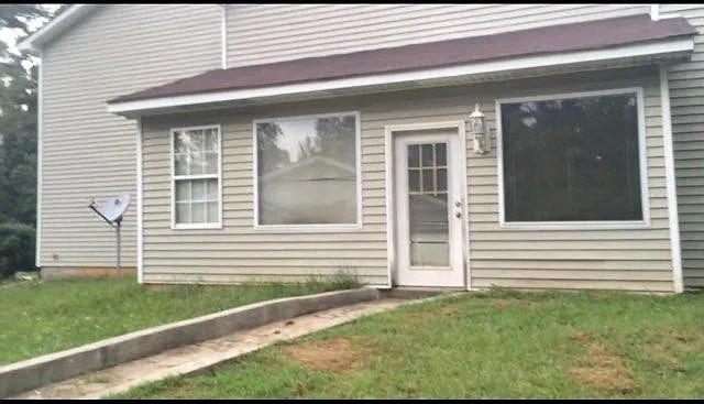 Right side separate entrance to downstairs bedroom with fireplace.