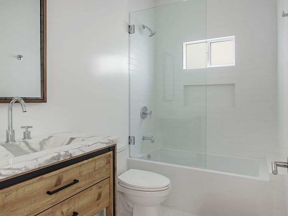 Sleek bathroom with frameless shower door