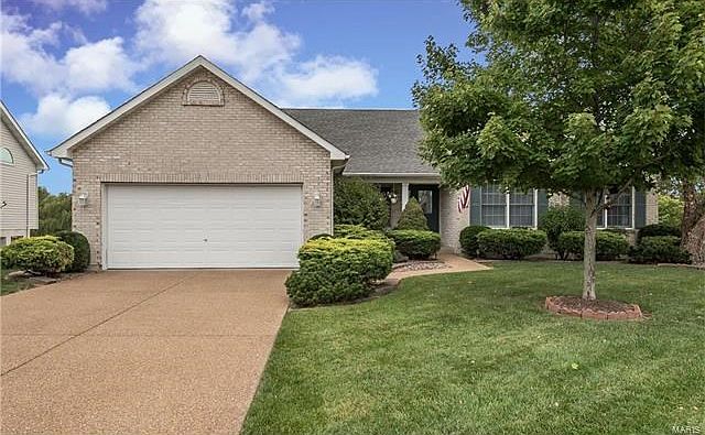 Atrium ranch on cul-de-sac backing to the lake in Village of Dardenne! Home is beautifully landscaped with exposed aggregate driveway and sidewalk. Located just minutes from Page Extension, Hwy 40, and Hwy70!