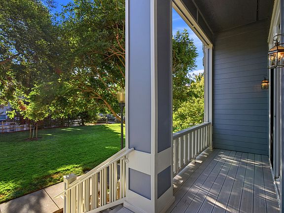 Covered front porch overlooking the landscaped community green space.