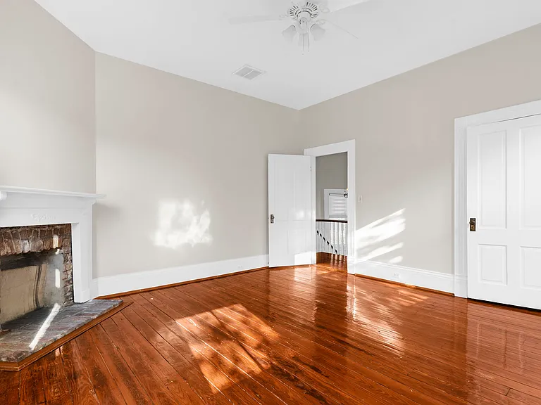 First Bedroom to the Left at the Top of the Stairs with Fireplace