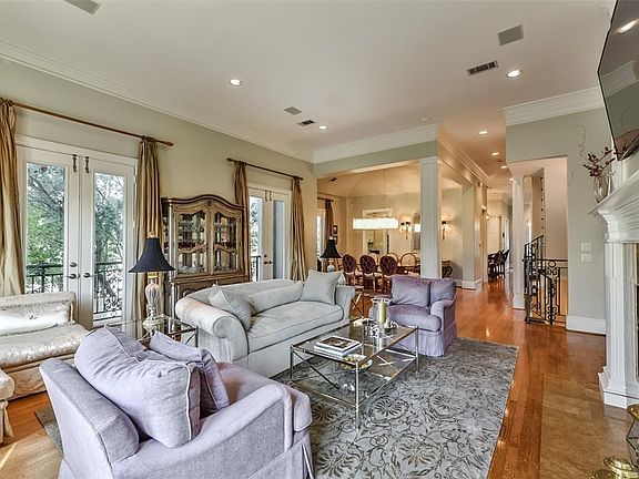 Another view of this grand room.  The spacious floor plan is accented with custom drapes and clean lines.