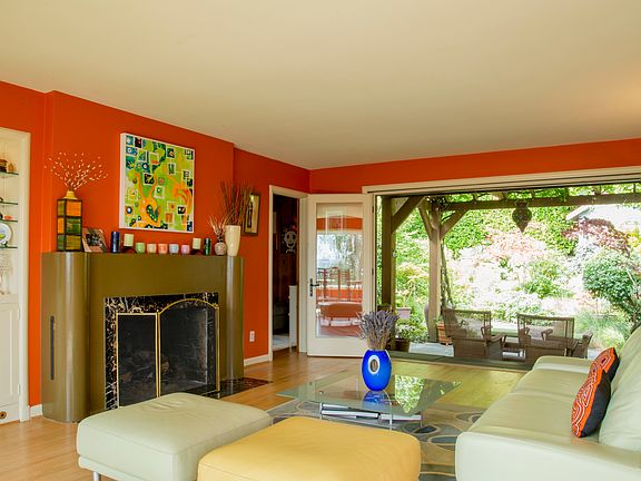 Living room has wall of accordion Nana doors that open into