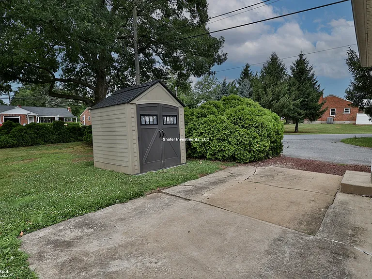 View of the parking spot and shed