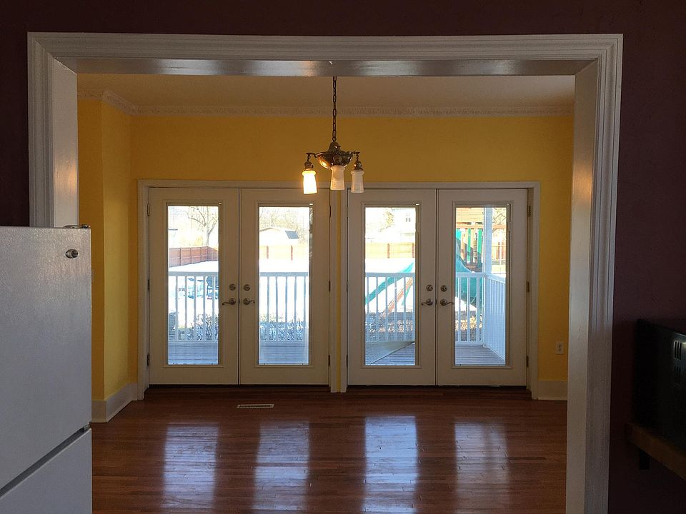 Living room looking into back yard through French doors