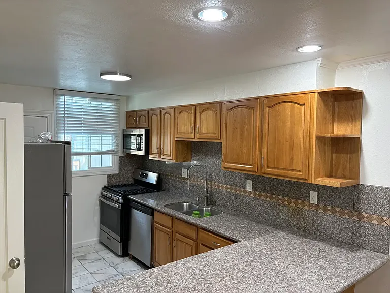 Recessed lighting in kitchen with dishwasher, stove, and gas stove