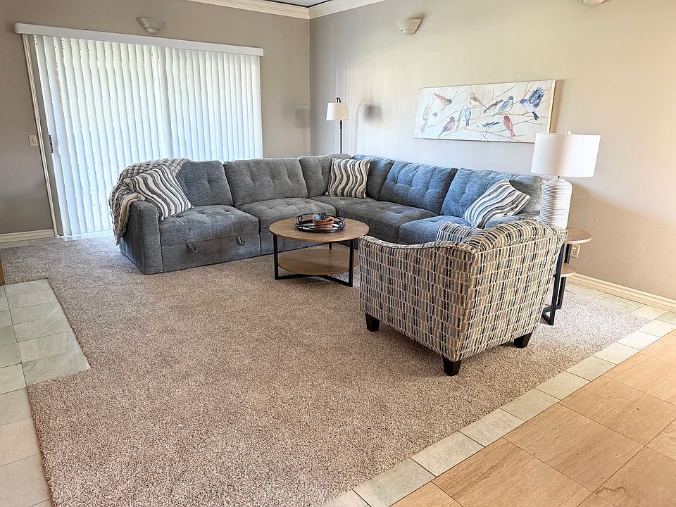 Living room with new carpet and furniture.